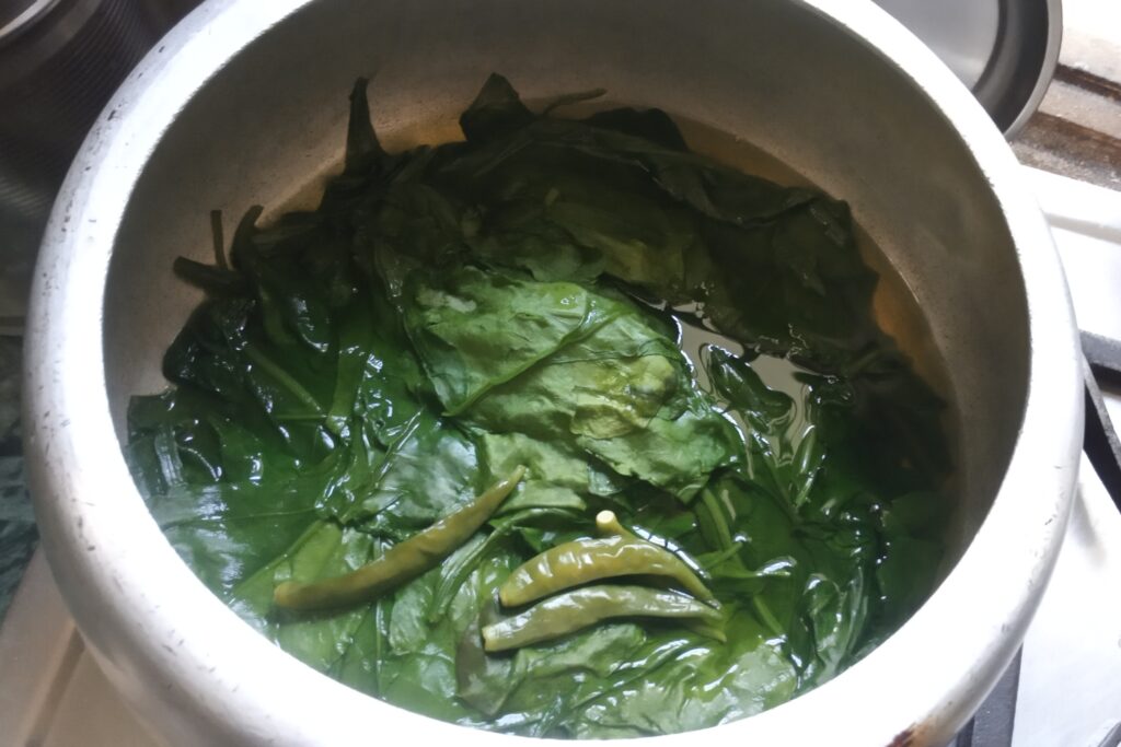 Pressure cooked spinach in cooker