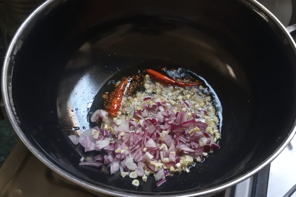 Adding chopped onion and garlic