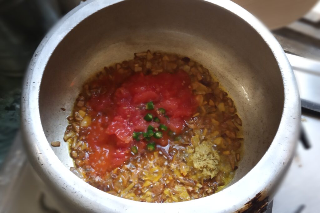 Preparing tadka for sabut urad dal