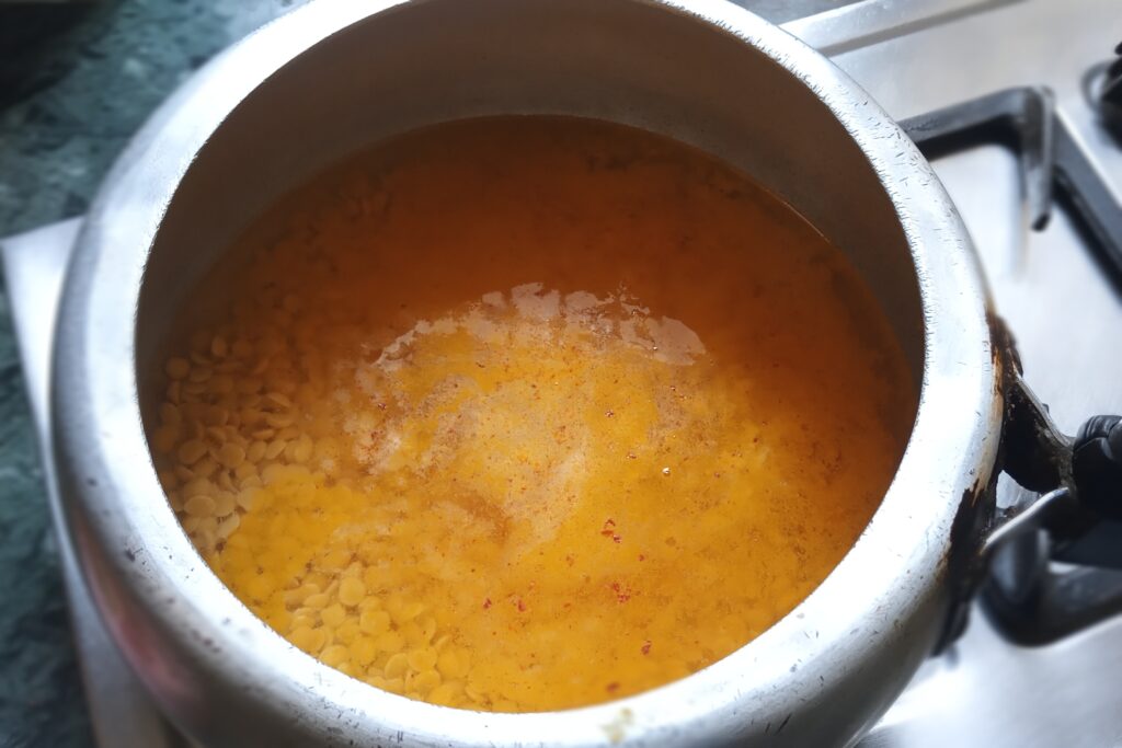 Adding spices in the dal
