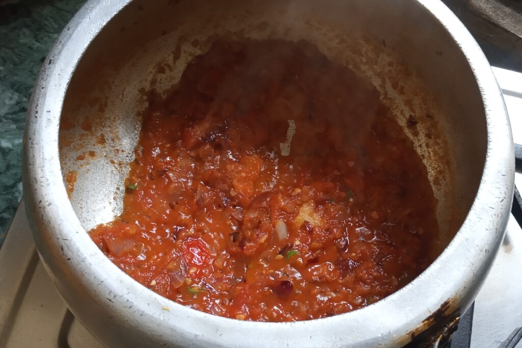 Tomatoes are cooking for dal tadka recipe