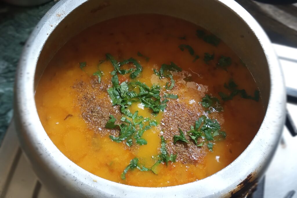 Adding masala and coriander leaves
