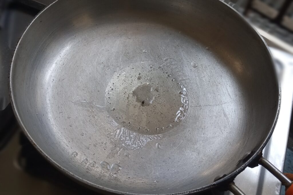 Heating ghee in a pan 