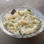 Jeera rice recipe in a bowl with basmati rice and cumin seeds