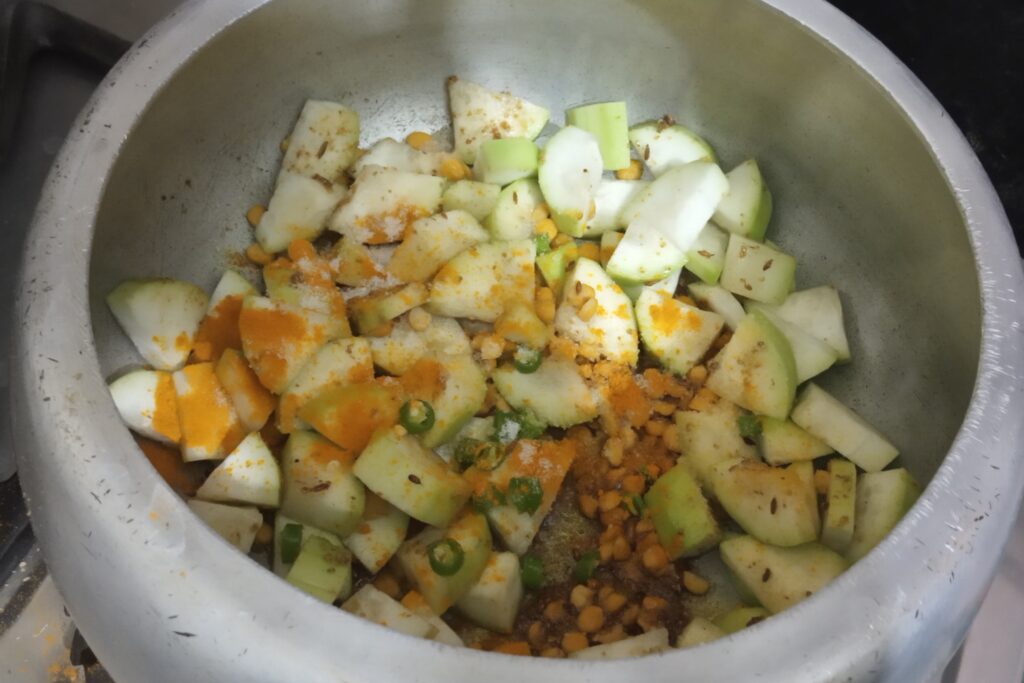 adding spices green chili and salt
