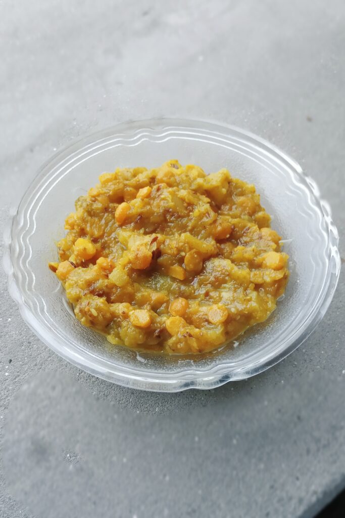 lauki chana dal dry recipe served in a glass bowl