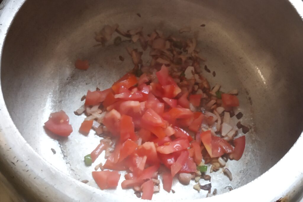 sauteing chopped tomato to soft