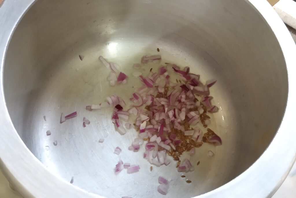 sauteing onion with cumin seeds