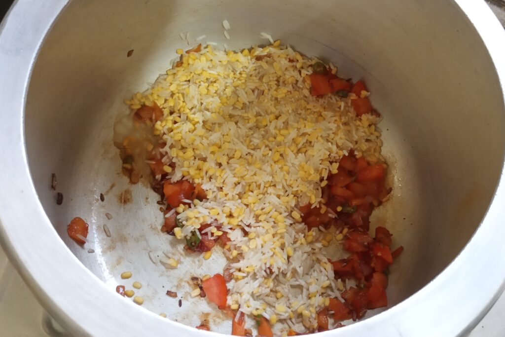 adding rice and dal to cooker