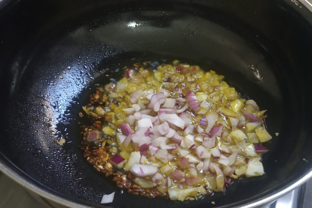 adding chopped onion to saute