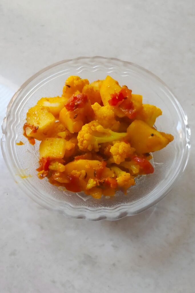 aloo gobhi sabzi served in a a glass bowl