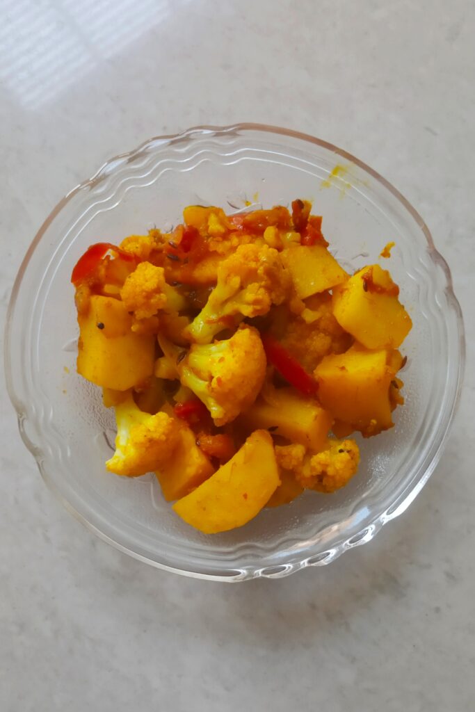 hot aloo gobhi sabzi served in a bowl