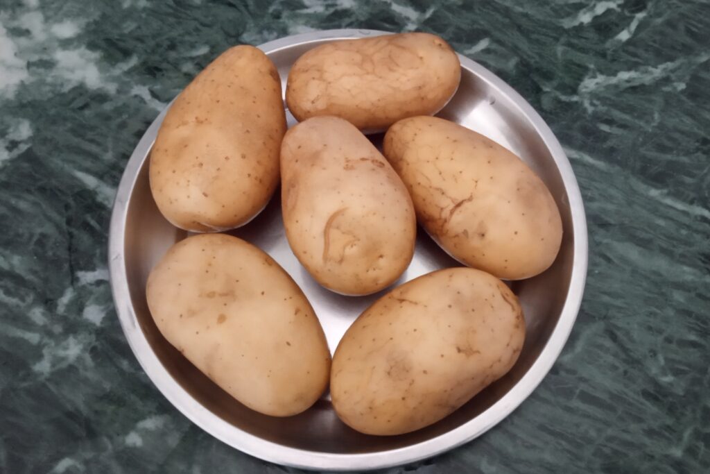 washed potatoes in a plate