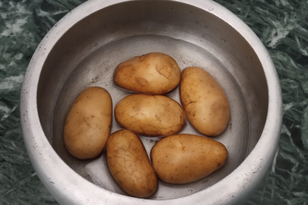 potatoes in pressure cooker with water