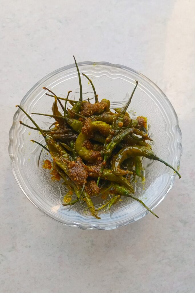 delicious hari mirch ka achar in a glass bowl