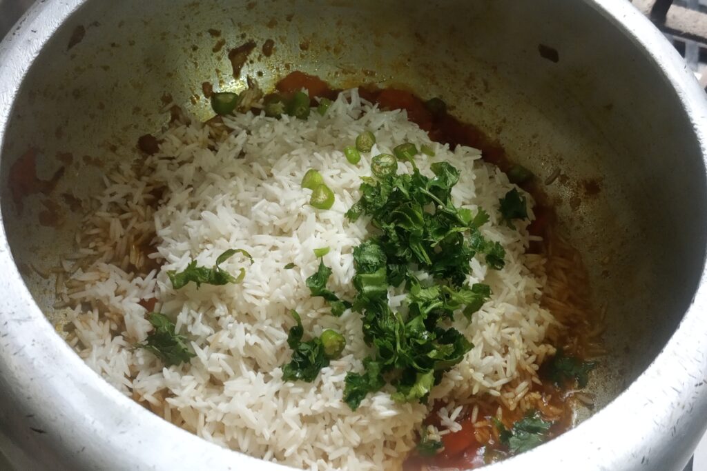 adding rice and green chilies