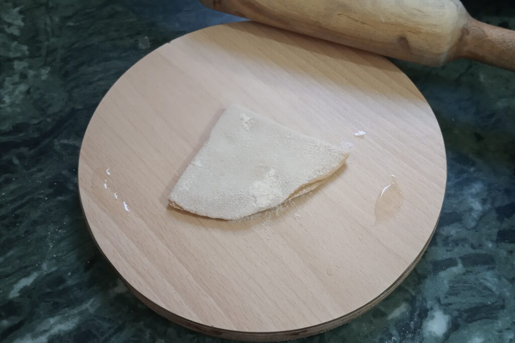 sprinkling flour on triangle