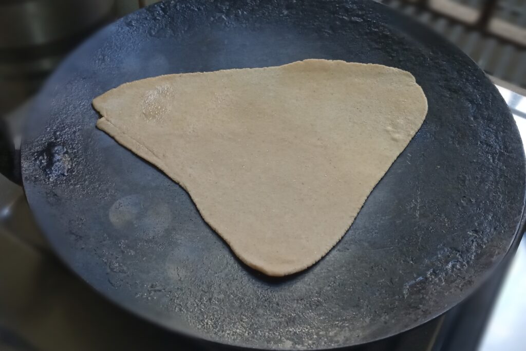 placed rolled triangle on tawa
