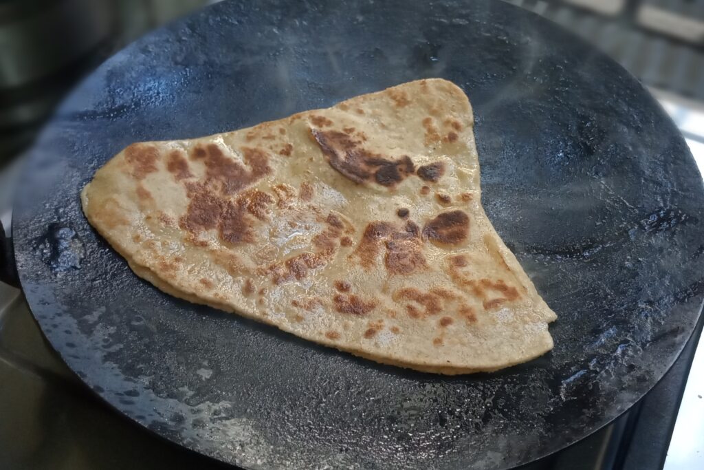 cooking plain paratha 