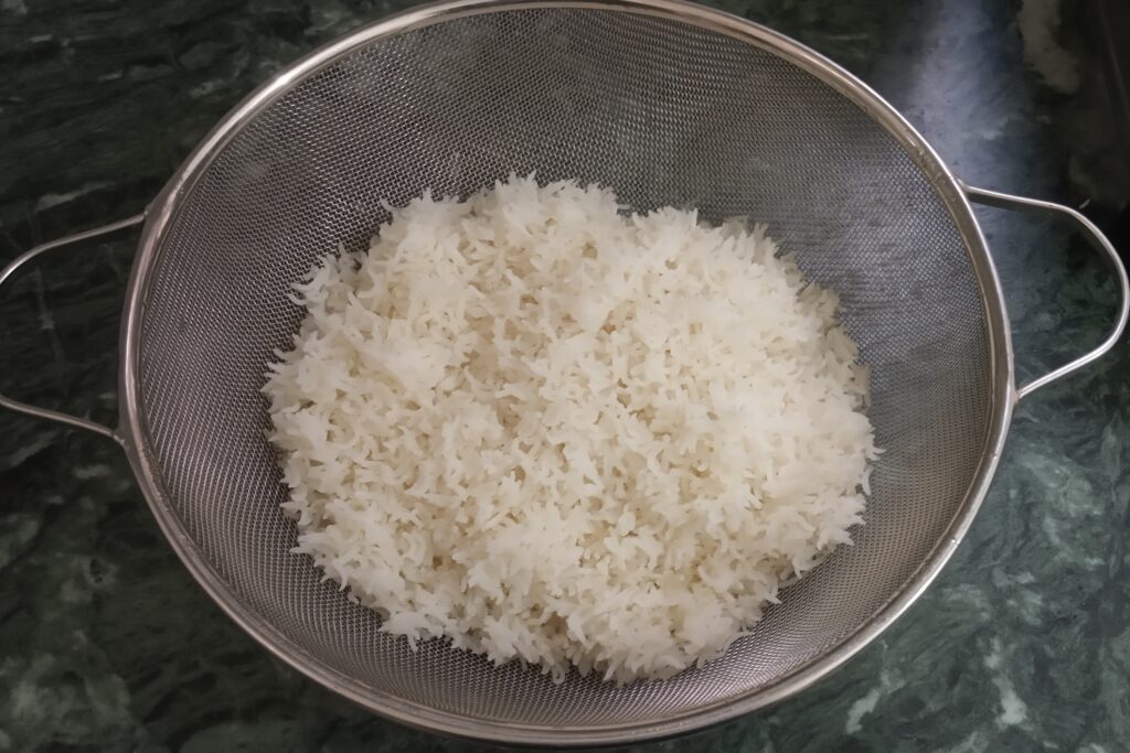 rice rests in the strainer