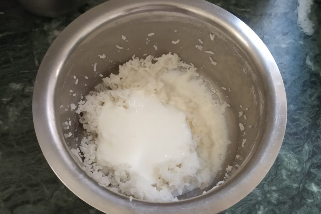 adding curd and milk to the rice