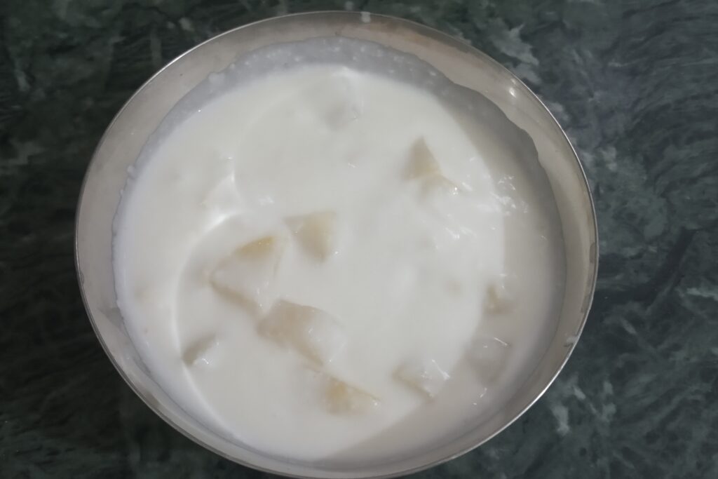 mixing potatoes in the curd