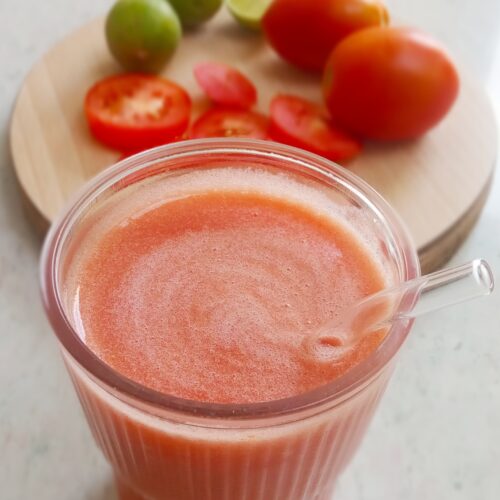tomato juice served a glass with straw