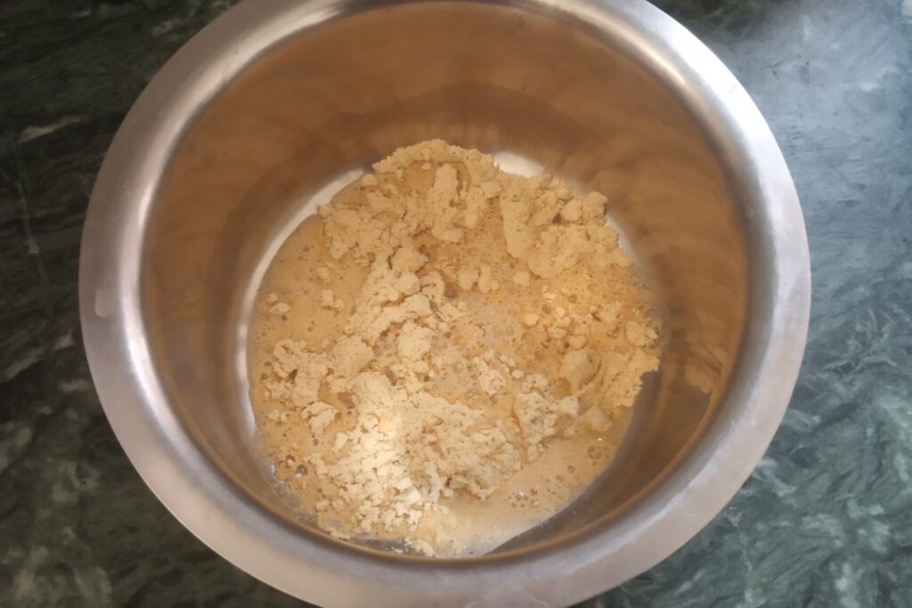 pouring water to the flour