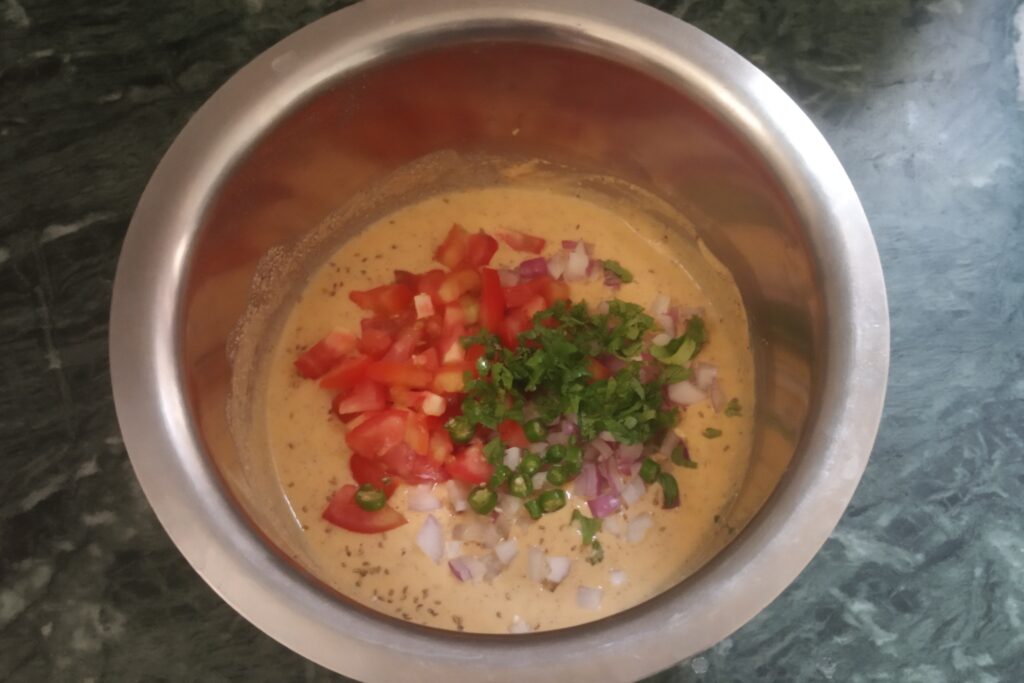adding vegetables and herbs to the batter
