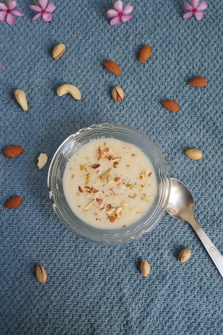 top shot of suji kheer recipe with a garnish of nuts