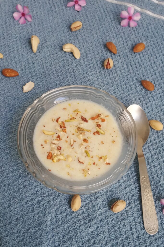 warm and delicious suji kheer with a garnish of nuts
