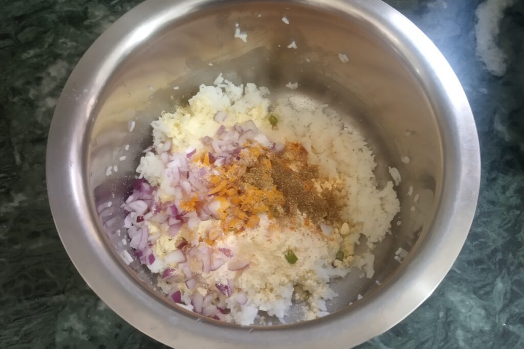 adding spices onion and green chili