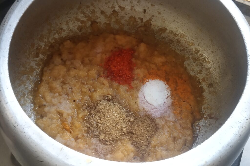 adding all spices in the onion base