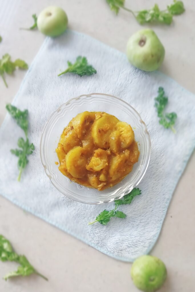 top shot of tinde ki sabji and herbs 