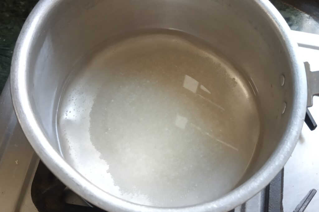 heating sugar and water in a pan