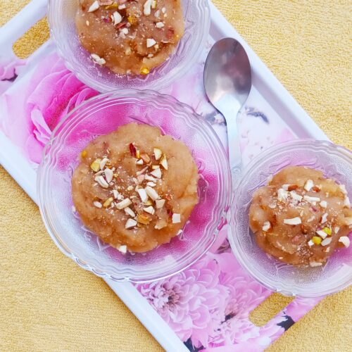 top shot of wheat halwa recipe served in three bowls with a spoon