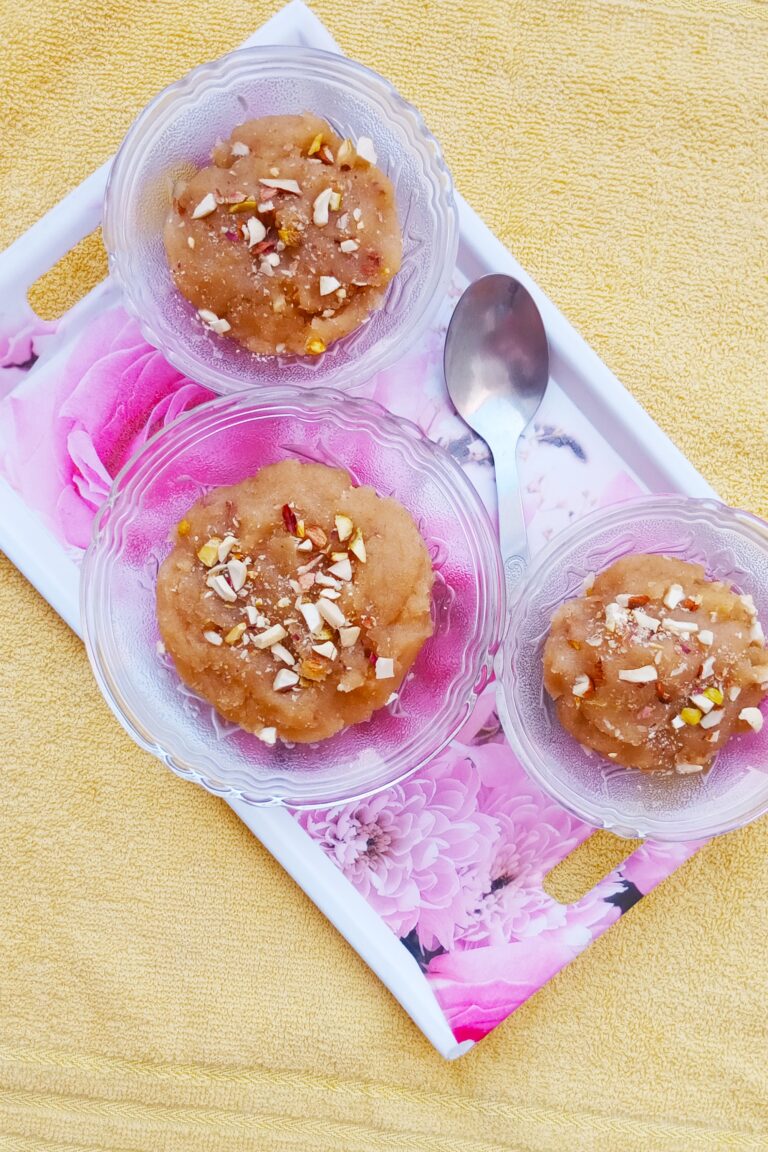 top shot of wheat halwa recipe served in three bowls with a spoon