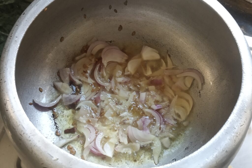 sauteing onions for chole pulao