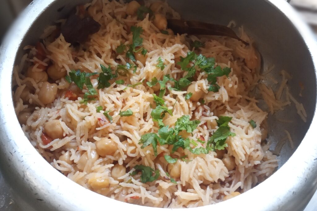 garnishing some chopped coriander leaves