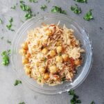 top shot of chole pulao served in a glass bowl