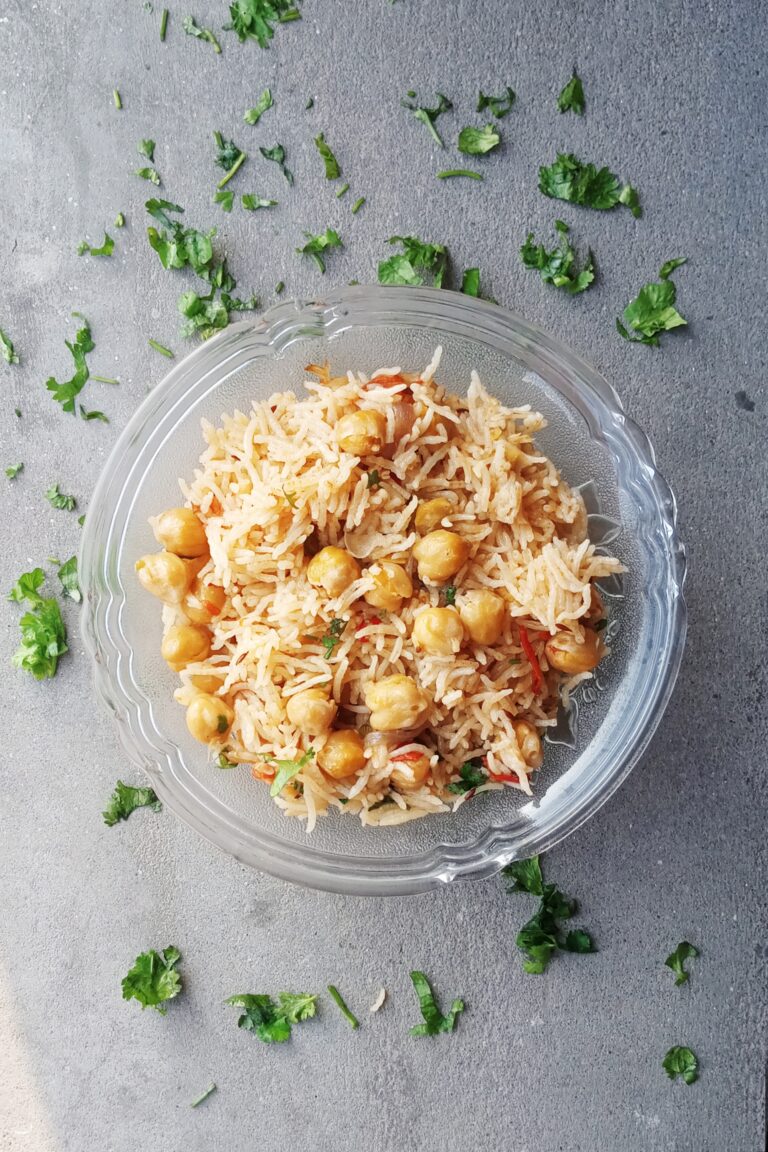 top shot of chole pulao served in a glass bowl