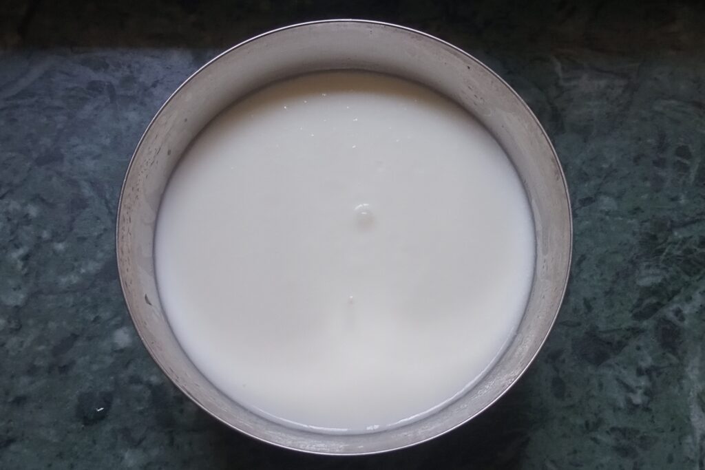 whisked smooth curd in a bowl
