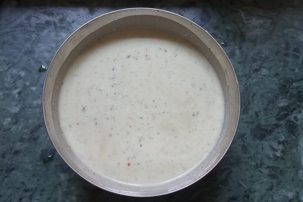 mixing all ingredients to make pudina raita
