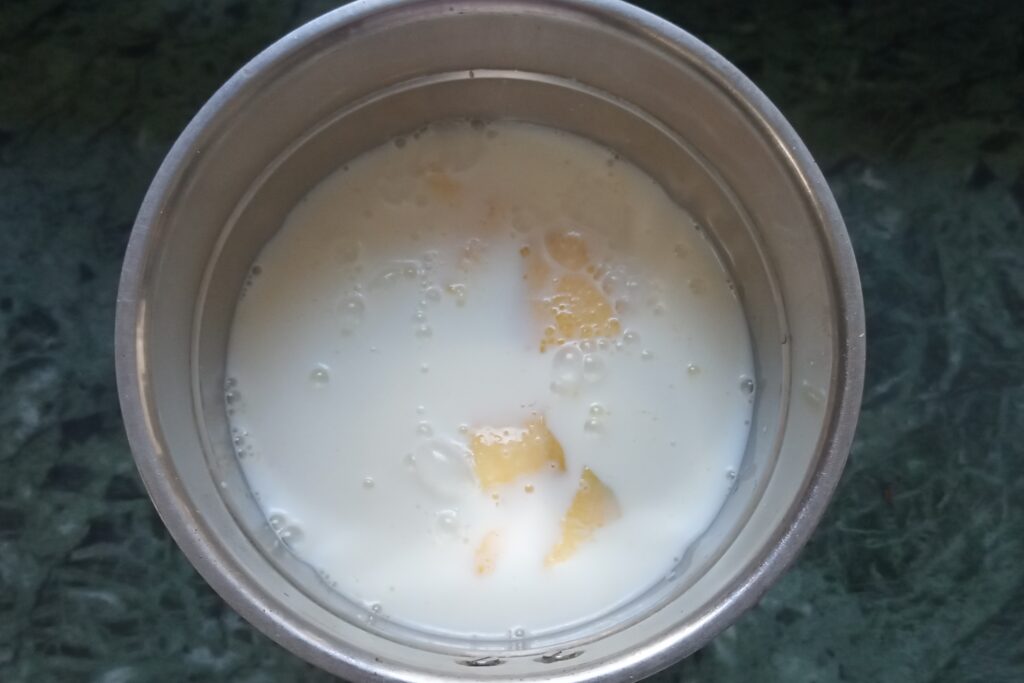 chilled milk is added in jar for mango shake
