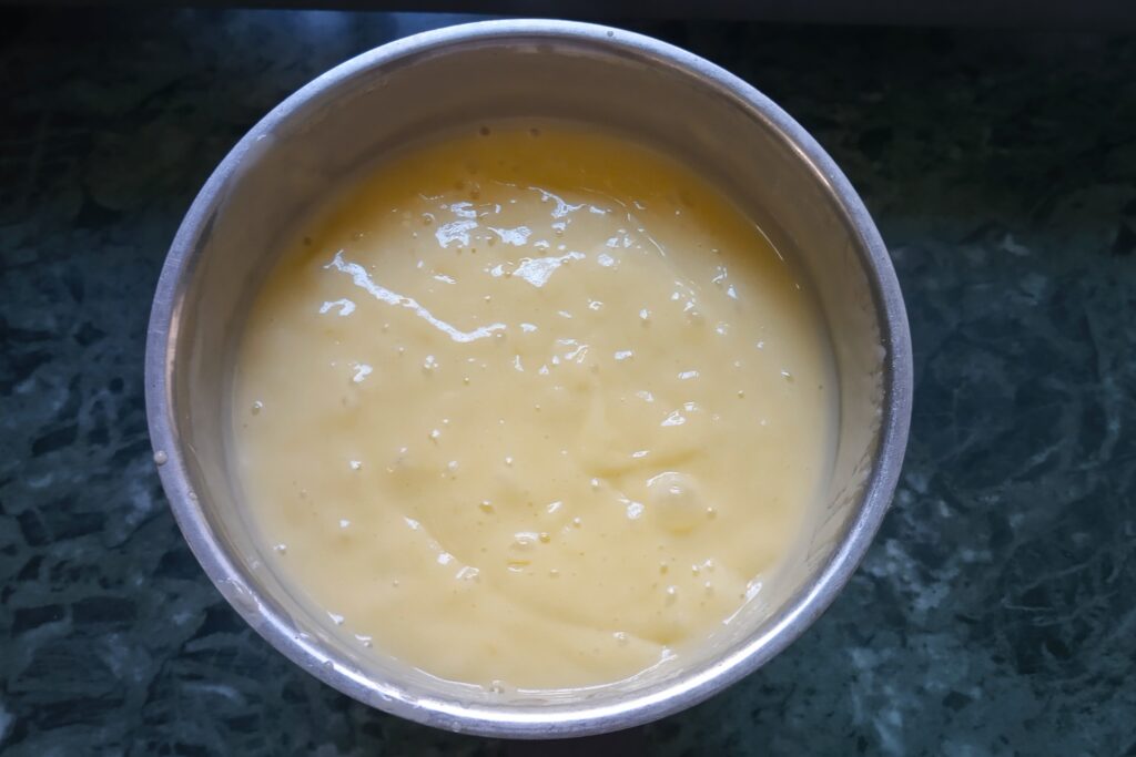 a smooth and creamy mango milkshake in a jar