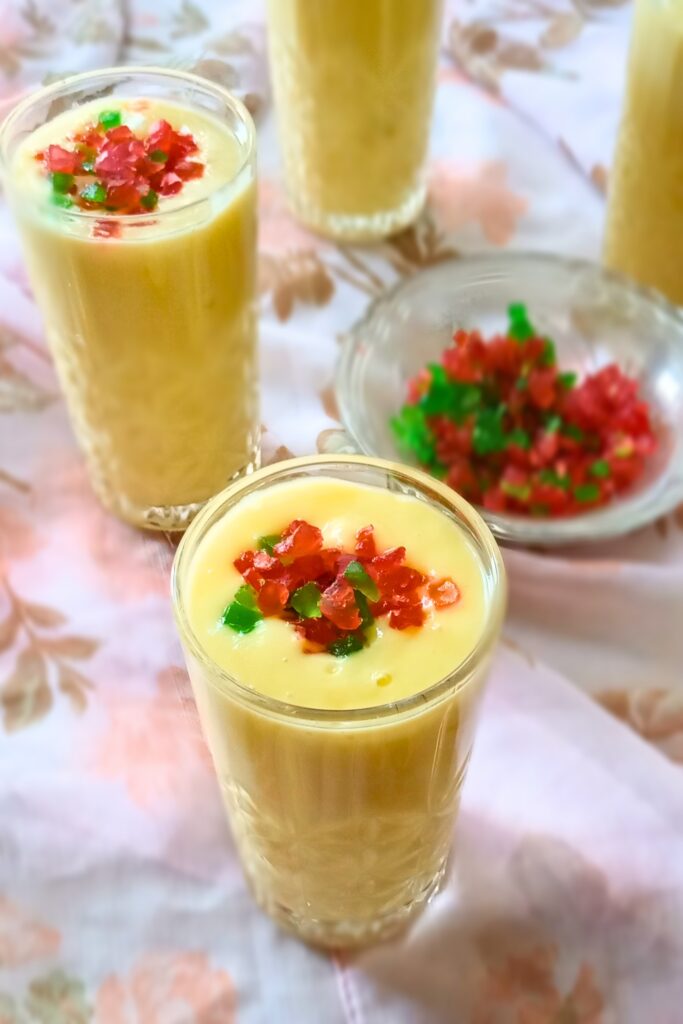 creamy mango milkshake with tutti fruity topping