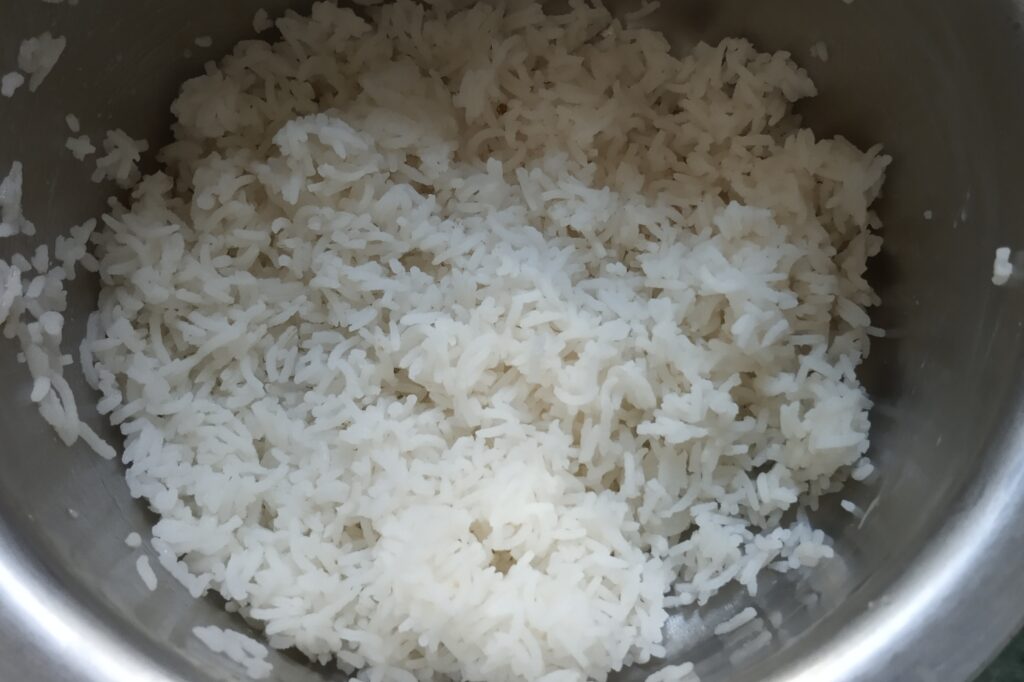 cooked rice in a mixing bowl