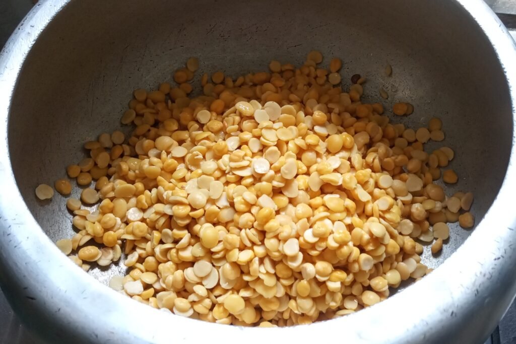 adding soaked dal to pressure cooker