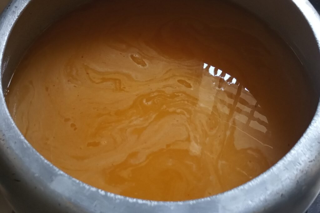 seasoning dal and water with spices