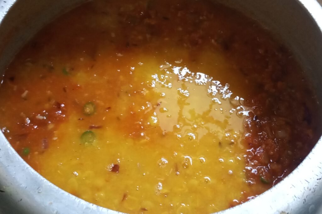 adding cooked dal to the masala